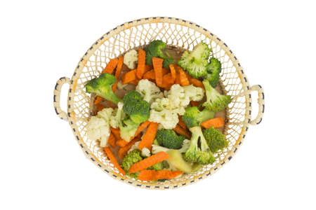 cauliflower. carrot. broccoli. slice. in basket wooden. isolated on white background.の写真素材