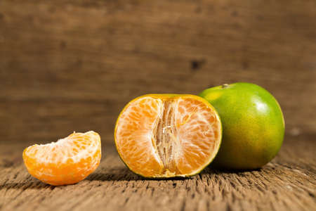 tangerine. sweet orange. on wooden. texture wooden.の写真素材
