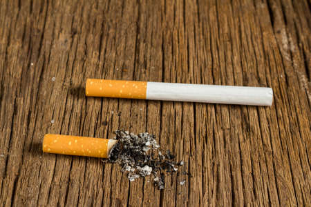 Tobacco cigarette. stub.  on wooden.の写真素材