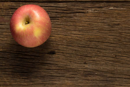 apple on old wooden. morning.