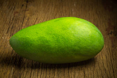 mango green on wood. asian. morning.の写真素材
