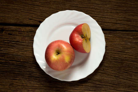 Apples on wooden background.
