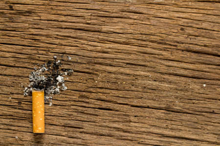 Tobacco cigarette. stub.  on wooden.
