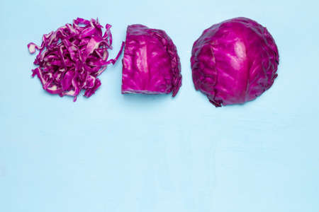 Purple Cabbage half and slice. space. on wood clor blue sky background.の写真素材