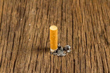 Tobacco cigarette. stub.  on wooden.の写真素材