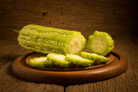 gourd. bitter. on old wooden. cut. slice.の写真素材