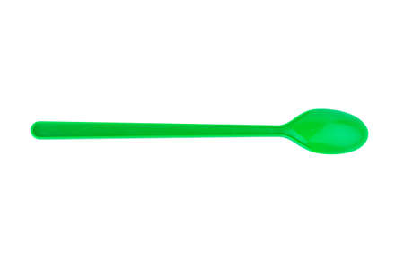 green spoon plastic isolated on white background.の写真素材