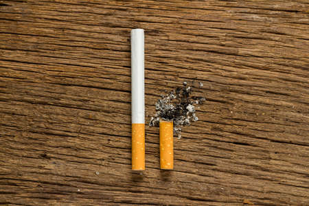 Tobacco cigarette. stub.  on wooden.