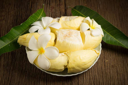 durian peeled ripe. King of fruit Thailand on the wooden table floor.