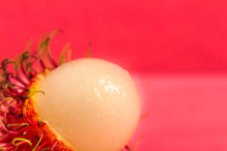 rambutan fruit on wood color pink.の写真素材