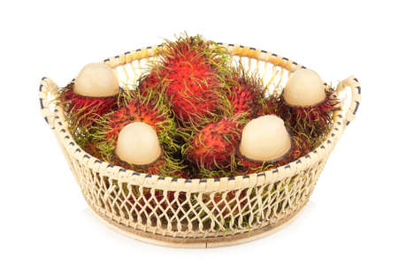 rambutan in basket isolated on white background.の写真素材