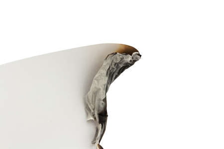 burned white paper on a white background. space.
