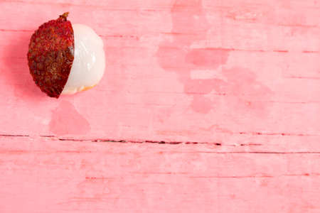 lychee fresh on pink wood.