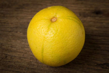 Bergamot oranges color yellow on old wood.の写真素材