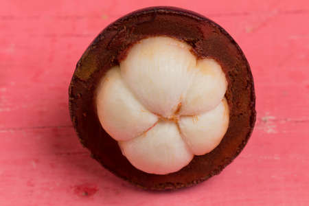 mangosteen on wood pink.