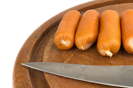 sausages on chopping  board on isolated on white background.の写真素材
