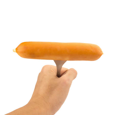 hand hold sausage on fork steel isolated on white background.の写真素材