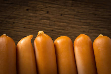 sausages wall. fence. on old wood background.の写真素材