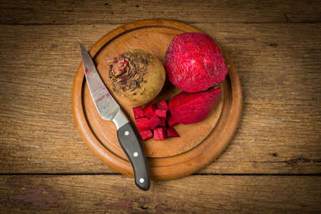 beetroot with knife on wooden.