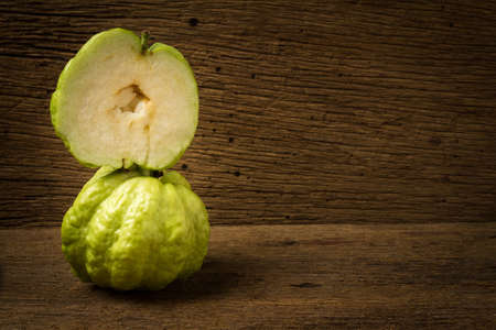 guava fruit on wood.