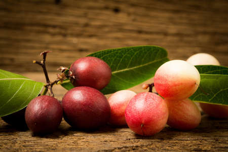 Karonda Fruit on old wood.の写真素材