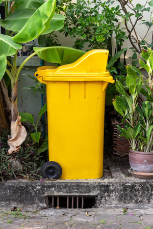 yellow trash can clean dustbin disposal recycling.の写真素材