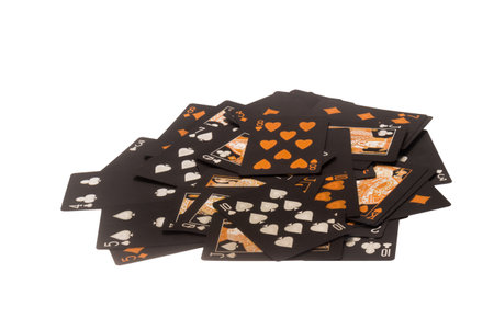 Deck of cards spread out pile gambling black gold.
