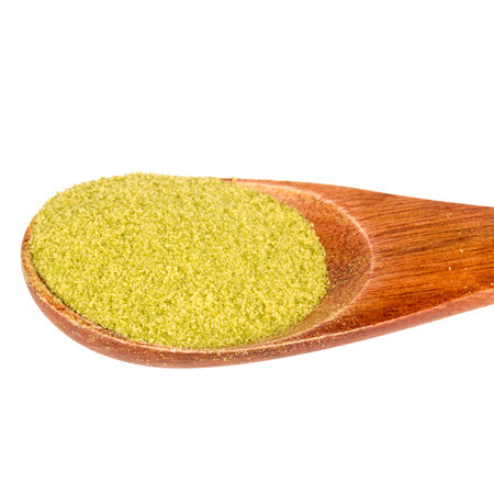 Green tea powder on a wooden spoon.の写真素材