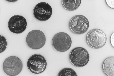 Scattered Coins on white background.