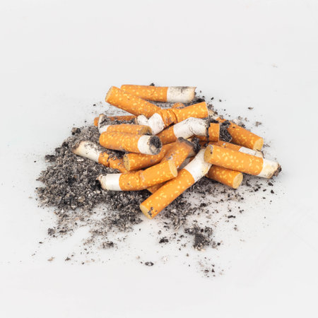 Pile of Cigarette Butts on White Background.