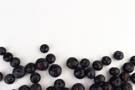 Blueberries scattered on a white background..の写真素材