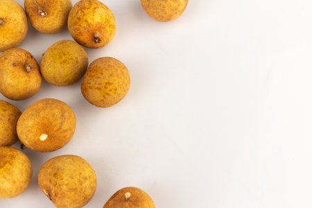 Longan Fruits Scattered and Piled on White Background.の写真素材