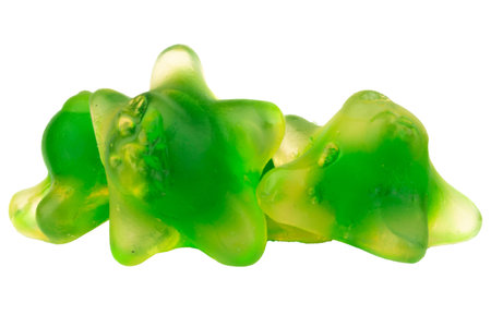 Pile of Green Starfish Jelly Gummy Candies Isolated on White Background.の写真素材