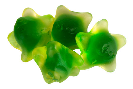 Pile of Green Starfish Jelly Gummy Candies Isolated on White Background.の写真素材