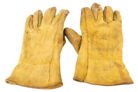 Yellow work gloves Dirty Old isolated on white background.の写真素材