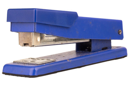 Dirty old stapler on white background.の写真素材