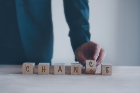 change to chance Personal development and career growth or change yourself concept. businessman flip wooden cube with word change to chance. positive thinking from change to be a chance to success.の写真素材