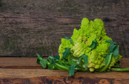 Fresh cabbage grade Romanesco on a wooden background, close-upの写真素材