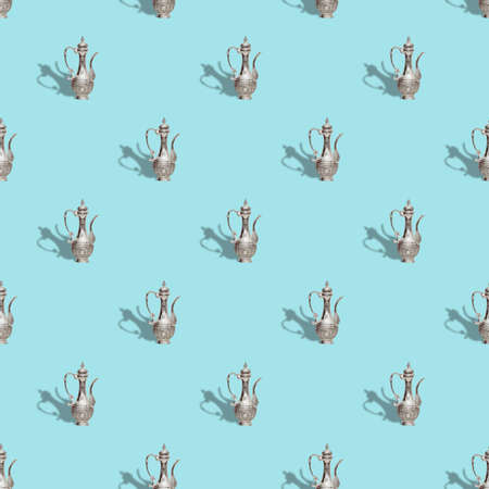 Seamless pattern with vintage old teapot on trendy blue background, isometric styleの写真素材