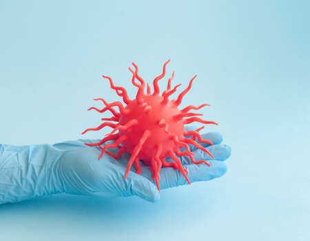 Covid-19 blue abstract background. Dangerous Coronavirus distribution model and hand. Pandemic...