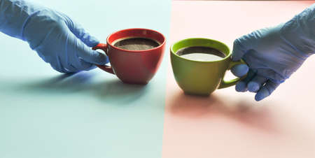 Americano in the different cups. maintaining distance during the coronovirus pandemicの写真素材