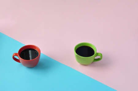 Americano in the different cups on the pink background. Flat Lay, cheerful day concept. This image...