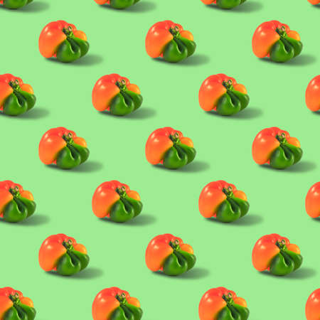 Ugly orange pepper seamless pattern peppers on a green background.の写真素材