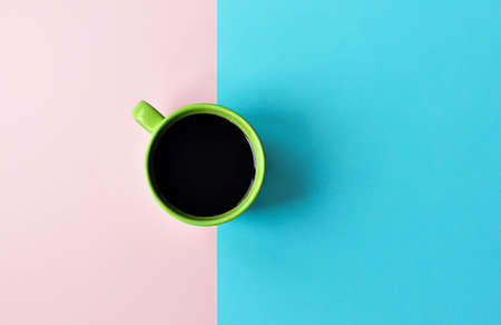 Americano in cups on the pink background. Flat Lay, cheerful day concept. This image could be used to show coffee break time or morning as a part of working dayの写真素材