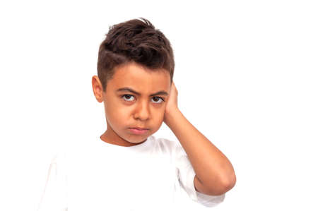 Child holding on to sore cheek, otitis media and toothache on whiteの写真素材