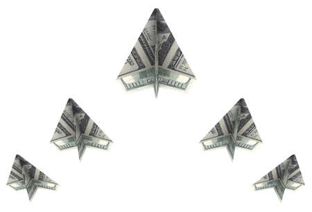 wedge of paper airplanes out dollars rise upの写真素材