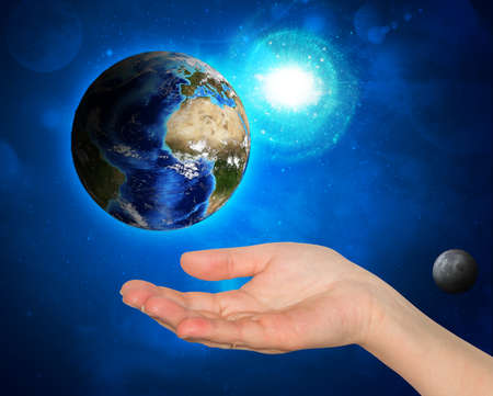 Hand holding earth