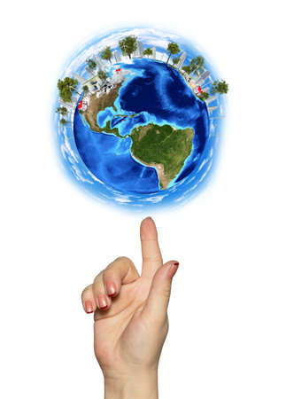 Hand goes to the planet Earth Isolated on white backgroundの写真素材