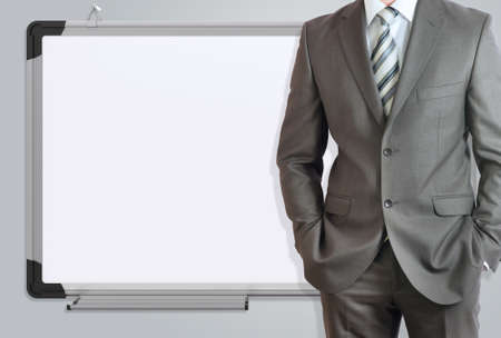 Man in suit and office board  Gray backgroundの写真素材