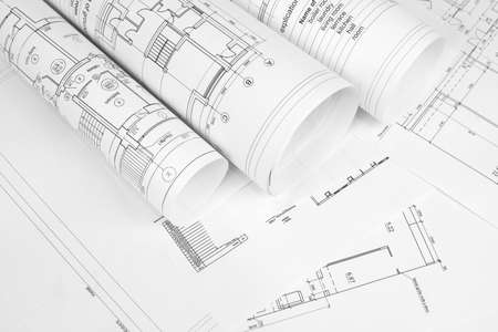 Scrolls of architectural drawings  The desk architectの写真素材